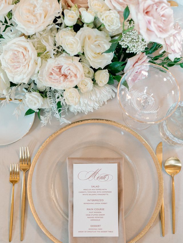 blush flowers and gold place settings for spring wedding