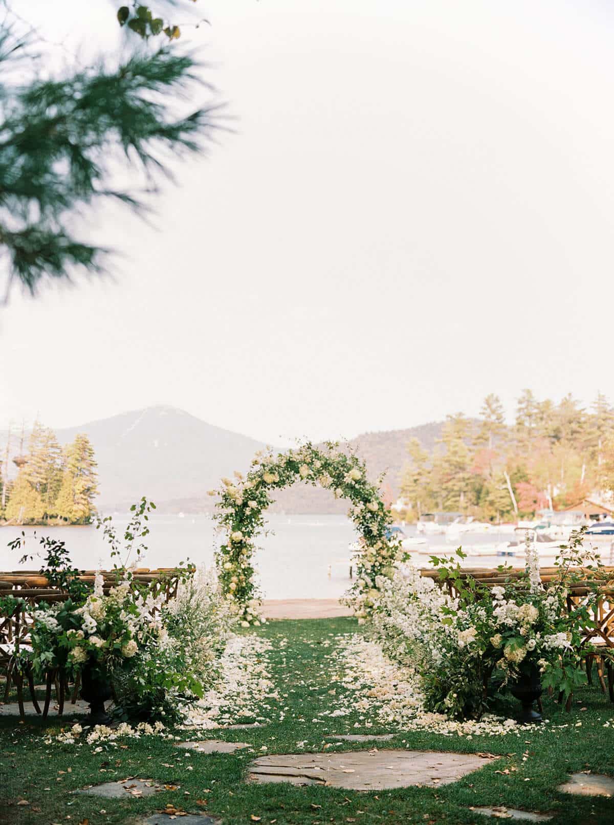 floral ceremony arch at lake placid wedding