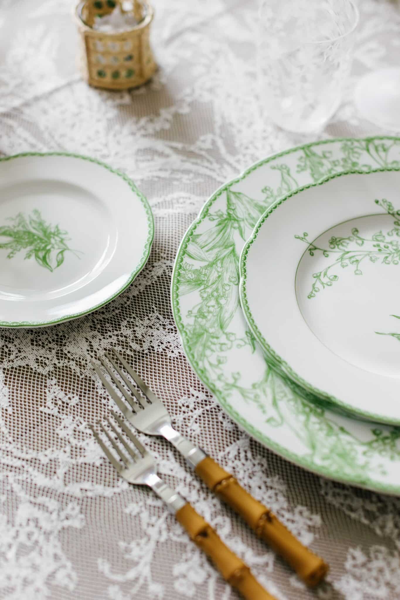 Dior Lily of the Valley tableware on lace tablecloth 