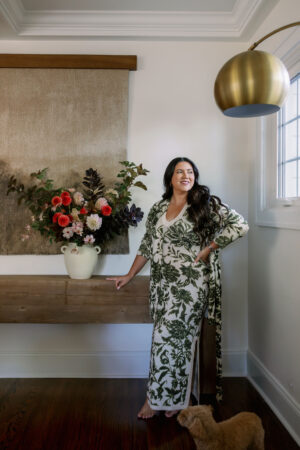 karina next to fall floral arrangement wearing matching dress set