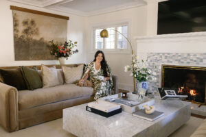modern living room with oversized marble coffee table and blue tile mantel