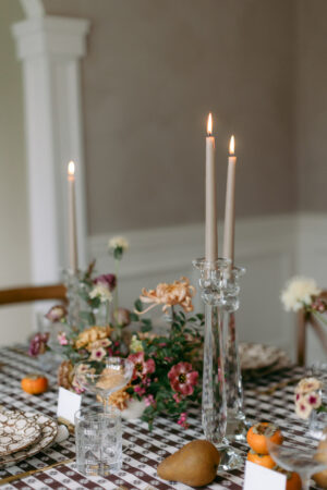 taupe candles in crystal candlesticks