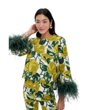 green floral top with feathers